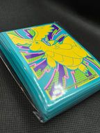Mega Dragonite Ascended Heroes Premium Card Sleeves. Side view of sealed packet and showing sleeve count of 65. 